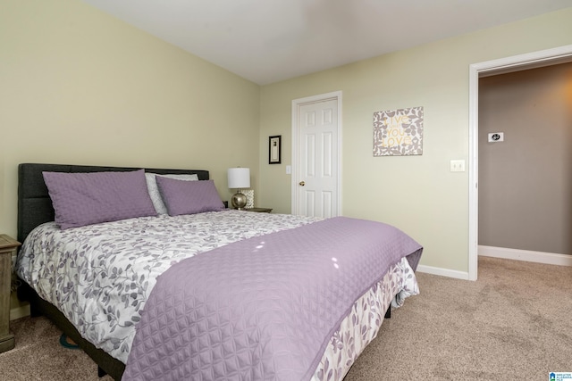 carpeted bedroom with baseboards