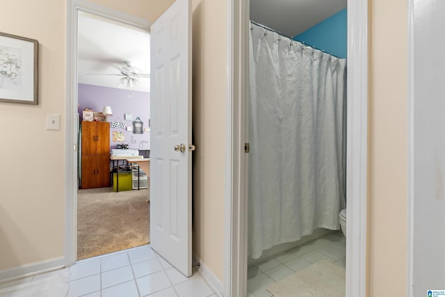 full bath with baseboards, a ceiling fan, toilet, and tile patterned floors