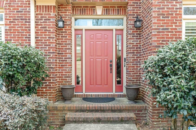 property entrance with brick siding