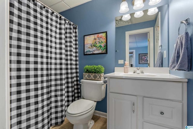 full bathroom featuring tile patterned flooring, curtained shower, vanity, and toilet