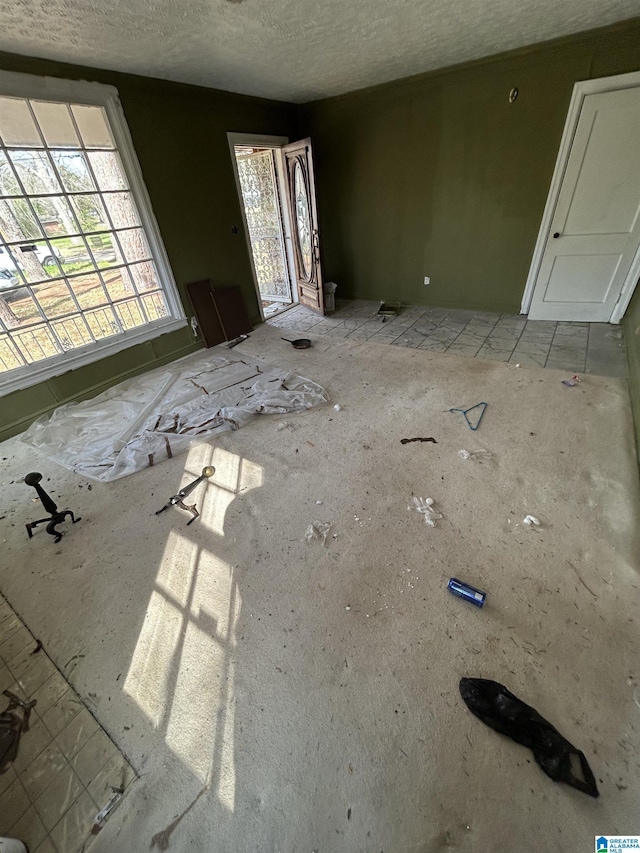 interior space featuring a textured ceiling