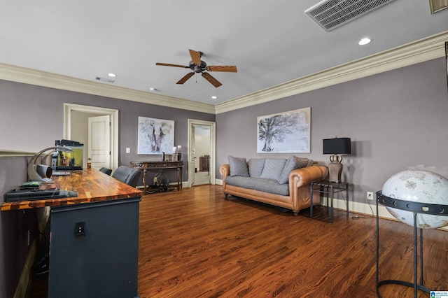 living room with baseboards, visible vents, and wood finished floors