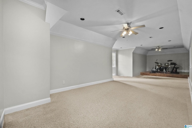 unfurnished living room featuring carpet floors, baseboards, visible vents, and ornamental molding