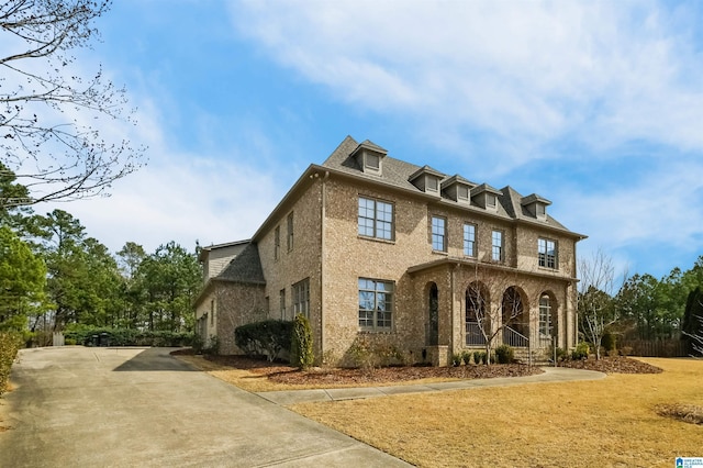 view of front of house with brick siding