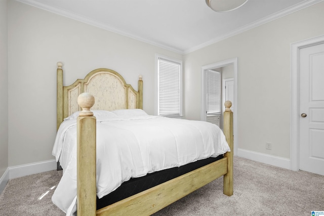 carpeted bedroom featuring baseboards and crown molding