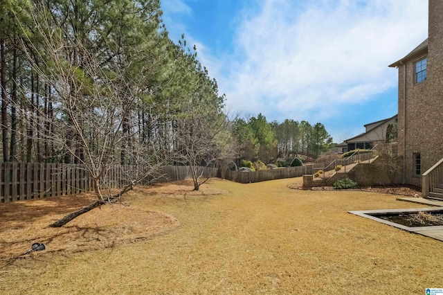 view of yard featuring a fenced backyard