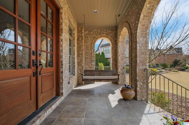 view of patio with covered porch and french doors