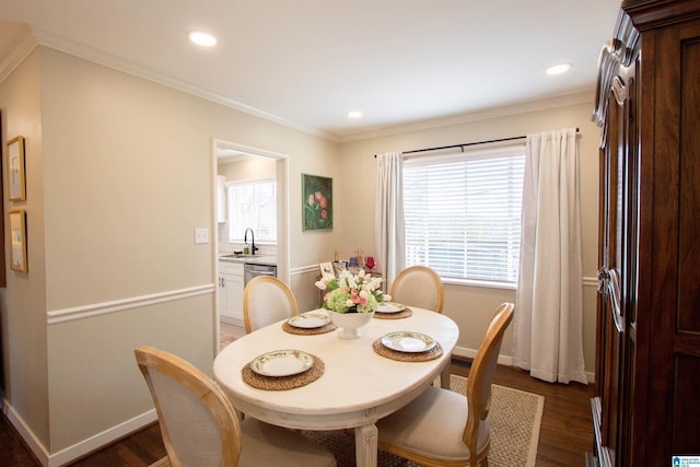 dining space featuring crown molding, baseboards, dark wood-style flooring, and recessed lighting