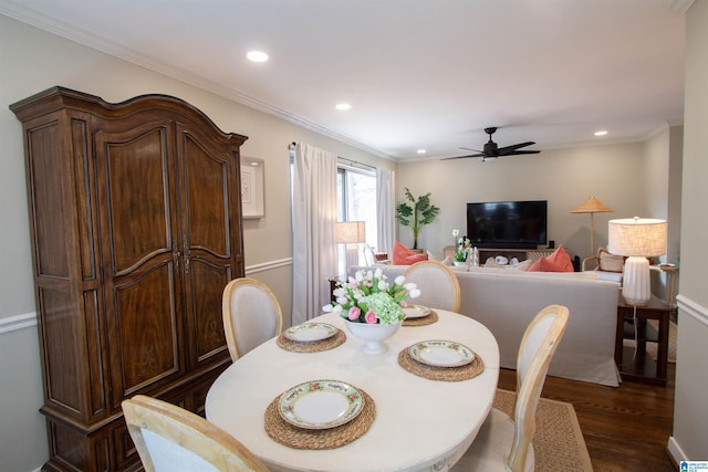 dining space with ornamental molding, dark wood finished floors, a ceiling fan, and recessed lighting