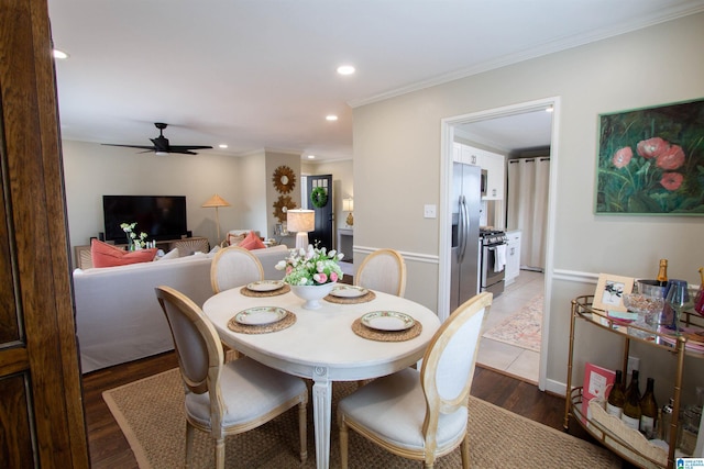 dining room featuring ornamental molding, recessed lighting, a ceiling fan, and wood finished floors