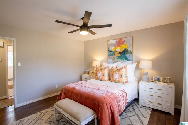 bedroom with ceiling fan, wood finished floors, and baseboards