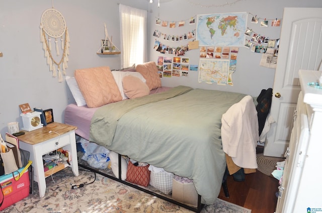 bedroom featuring wood finished floors