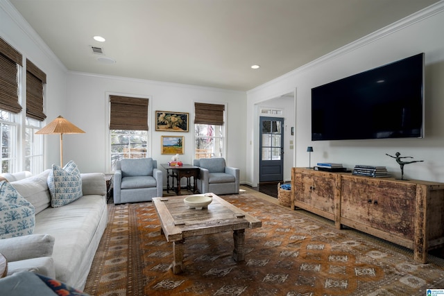 living room featuring recessed lighting, visible vents, and ornamental molding