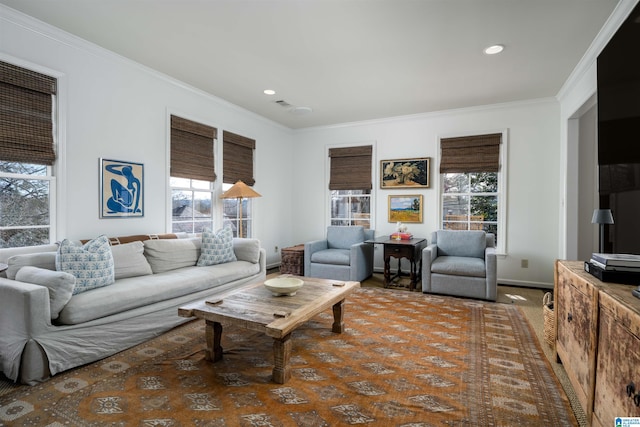 living room with recessed lighting, baseboards, plenty of natural light, and ornamental molding