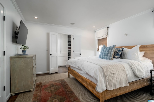 bedroom with recessed lighting, baseboards, ornamental molding, and wood finished floors