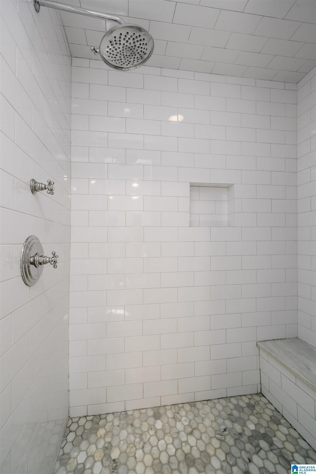 full bath featuring tiled shower