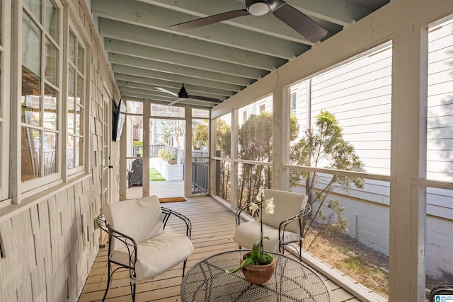 sunroom with a ceiling fan