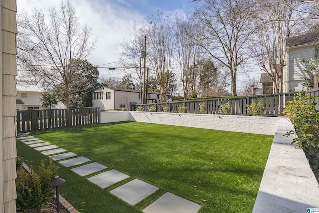 view of yard with a fenced backyard