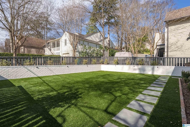 view of yard featuring a fenced backyard