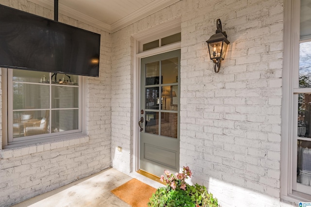 entrance to property with brick siding