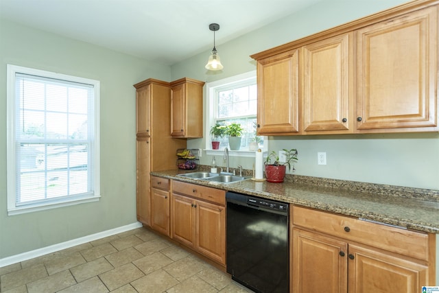 kitchen with a wealth of natural light, black dishwasher, a sink, and baseboards