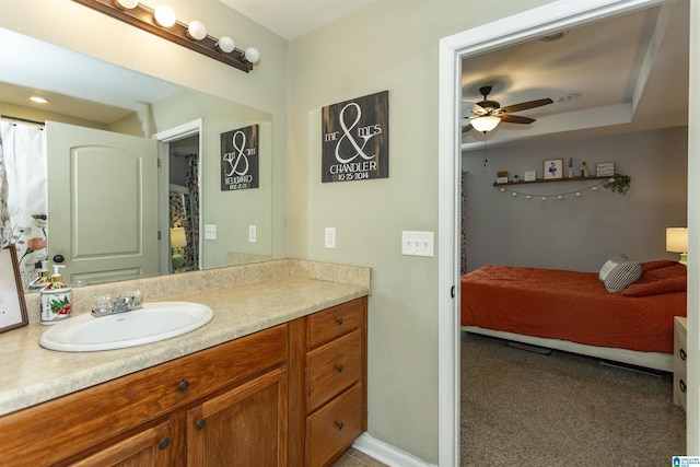 bathroom featuring ceiling fan and vanity