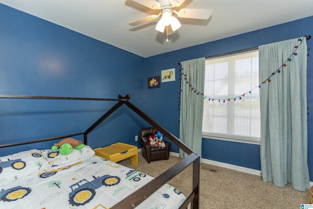 unfurnished bedroom featuring carpet flooring, ceiling fan, and baseboards