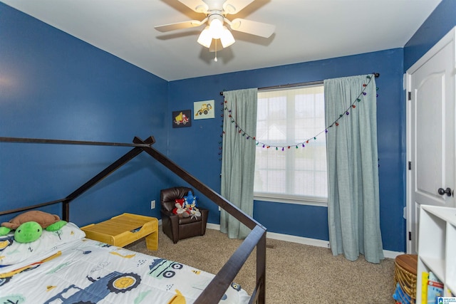 bedroom featuring ceiling fan, carpet flooring, and baseboards