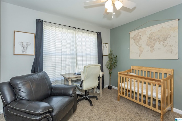 carpeted bedroom with a ceiling fan and baseboards