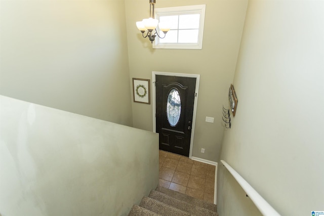 interior space with stairs and a notable chandelier