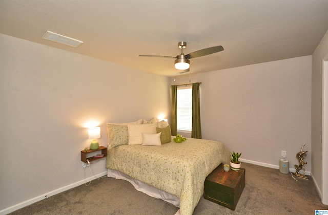 bedroom featuring dark colored carpet, a ceiling fan, visible vents, and baseboards