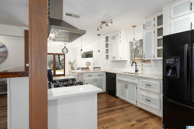 kitchen featuring wood finished floors, visible vents, black appliances, and open shelves