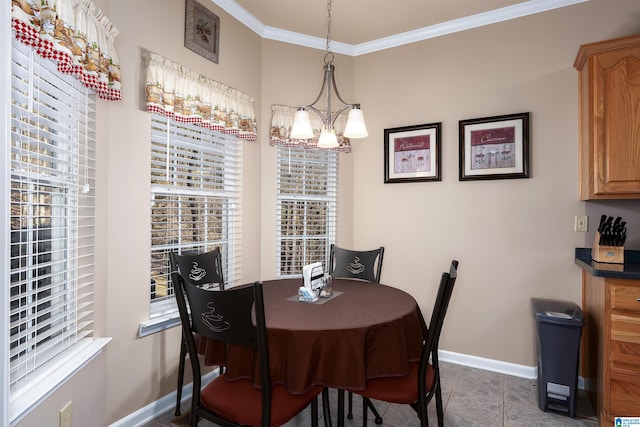 dining area with crown molding, dark tile patterned flooring, a healthy amount of sunlight, and baseboards