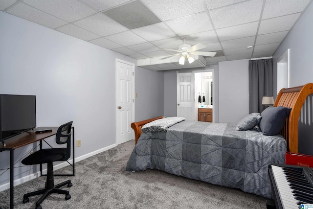 bedroom with a ceiling fan, a paneled ceiling, baseboards, and carpet floors