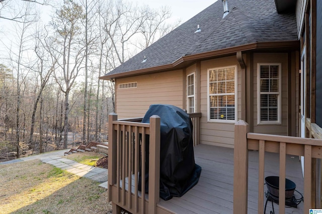 deck featuring a grill