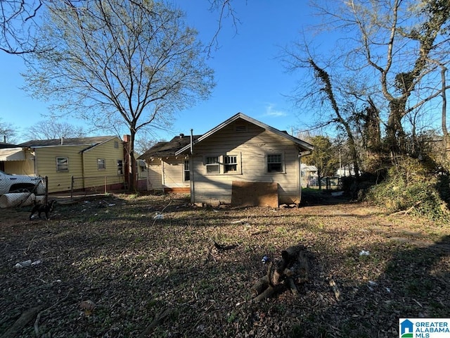 view of property exterior featuring fence