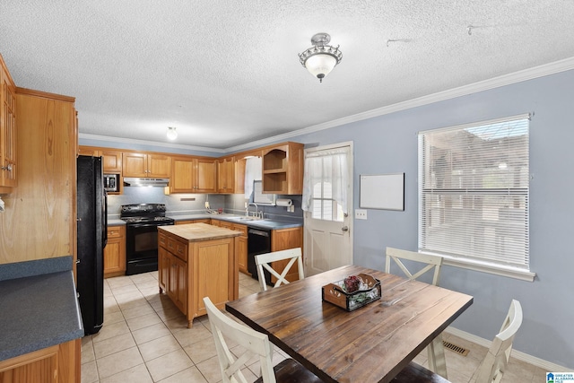 kitchen featuring open shelves, ornamental molding, light tile patterned flooring, a kitchen island, and black appliances