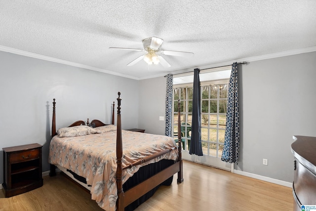 bedroom with light wood finished floors, baseboards, ornamental molding, and a textured ceiling