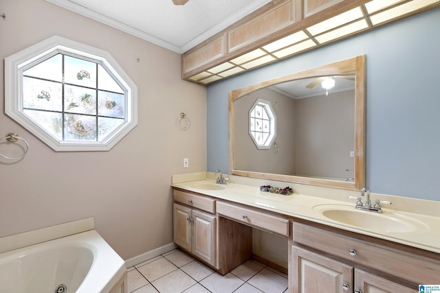 bathroom featuring ornamental molding, a sink, and tile patterned floors