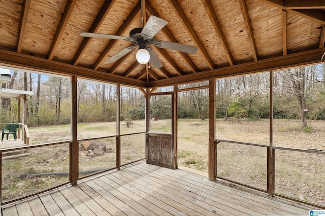 unfurnished sunroom with ceiling fan