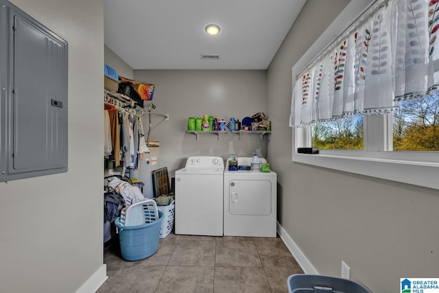 washroom with visible vents, separate washer and dryer, tile patterned flooring, laundry area, and electric panel