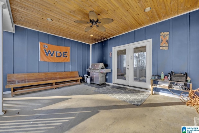 property entrance with a ceiling fan and french doors