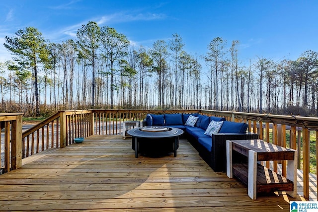 wooden deck featuring outdoor lounge area