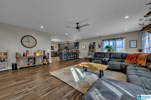 living room featuring recessed lighting, visible vents, ceiling fan, and wood finished floors