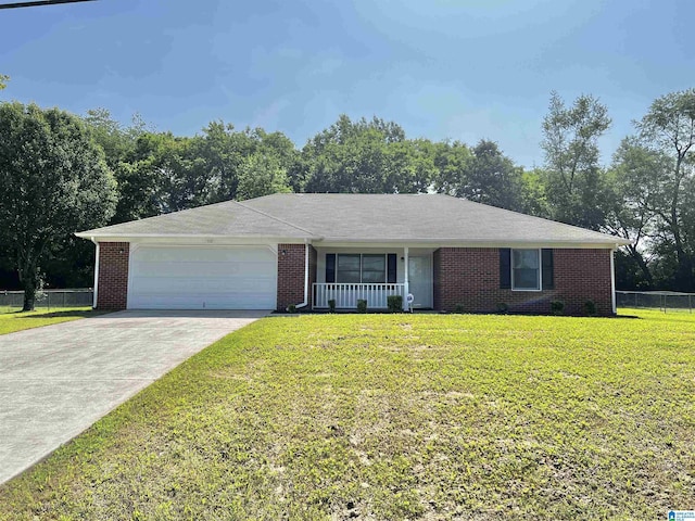 ranch-style house with driveway, brick siding, an attached garage, fence, and a front yard