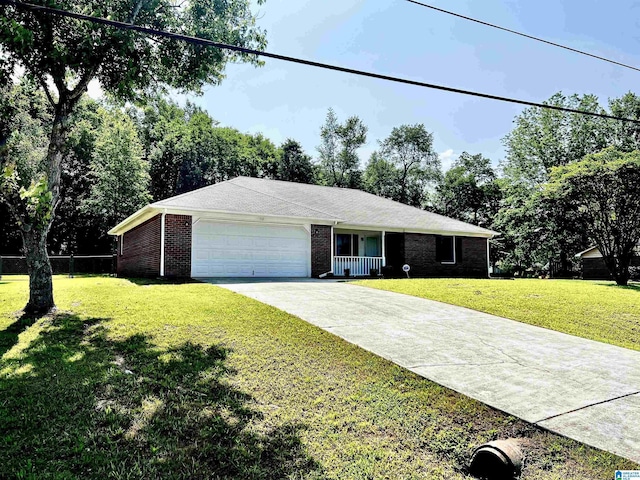 ranch-style house featuring a garage, driveway, brick siding, and a front yard