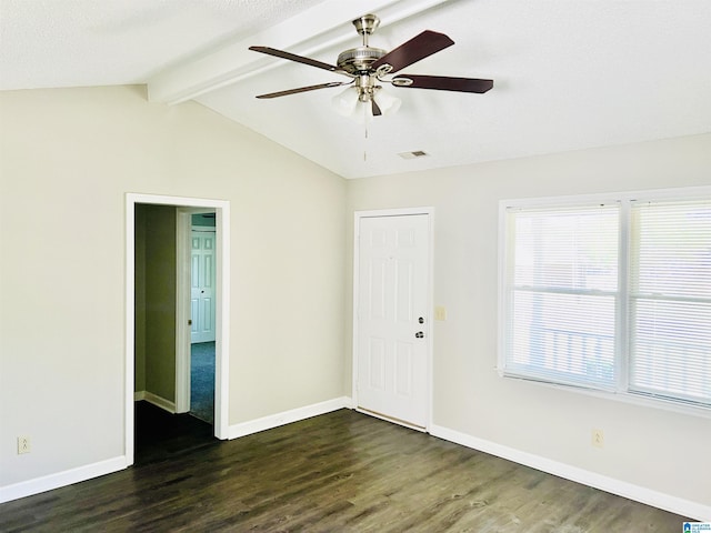 entrance foyer with lofted ceiling with beams, baseboards, and dark wood finished floors