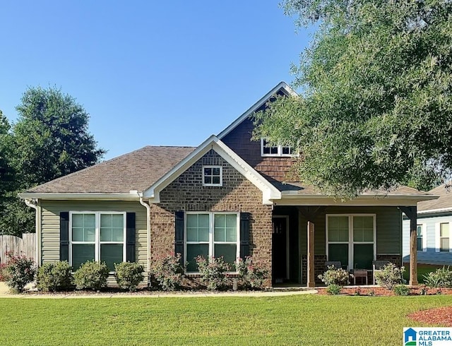 craftsman inspired home with brick siding and a front lawn