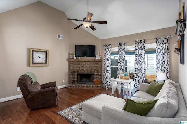 living room with visible vents, wood finished floors, a fireplace, baseboards, and ceiling fan