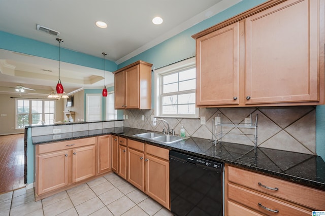 kitchen with a raised ceiling, visible vents, a sink, dishwasher, and a peninsula